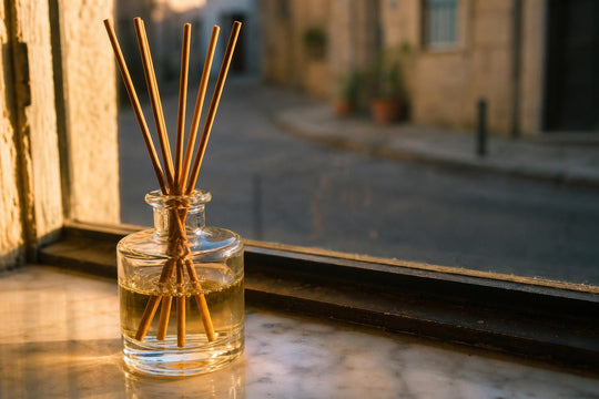 Close view of a reed diffuser's wooden sticks drawing oil upward by capillary action
