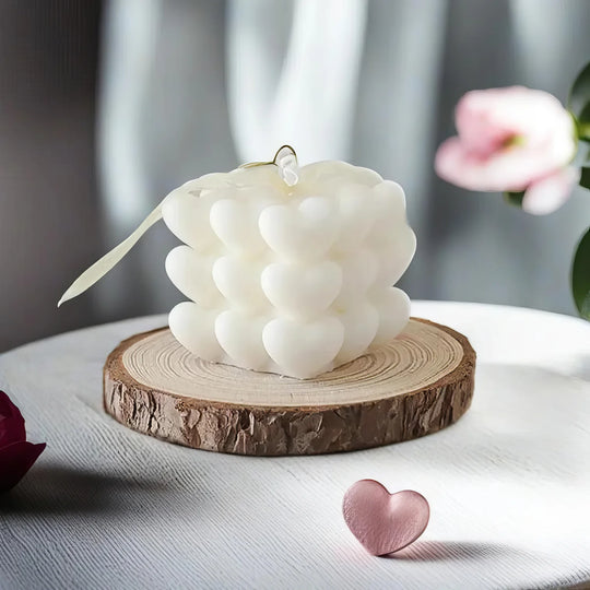 Natural wax candles in soy, beeswax and coconut wax glowing softly on a wooden surface