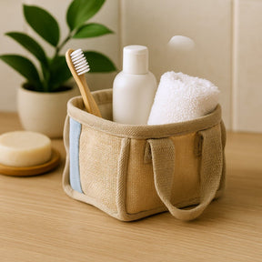 Woven basket with bath items including a toothbrush, bottle, towel, and soap on a wooden surface.