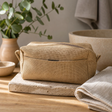 Jute Toiletry Bag - Natural — styled in a warm, naturally lit interior