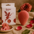 Konjac Sponge with packaging and rose petals on a textured surface