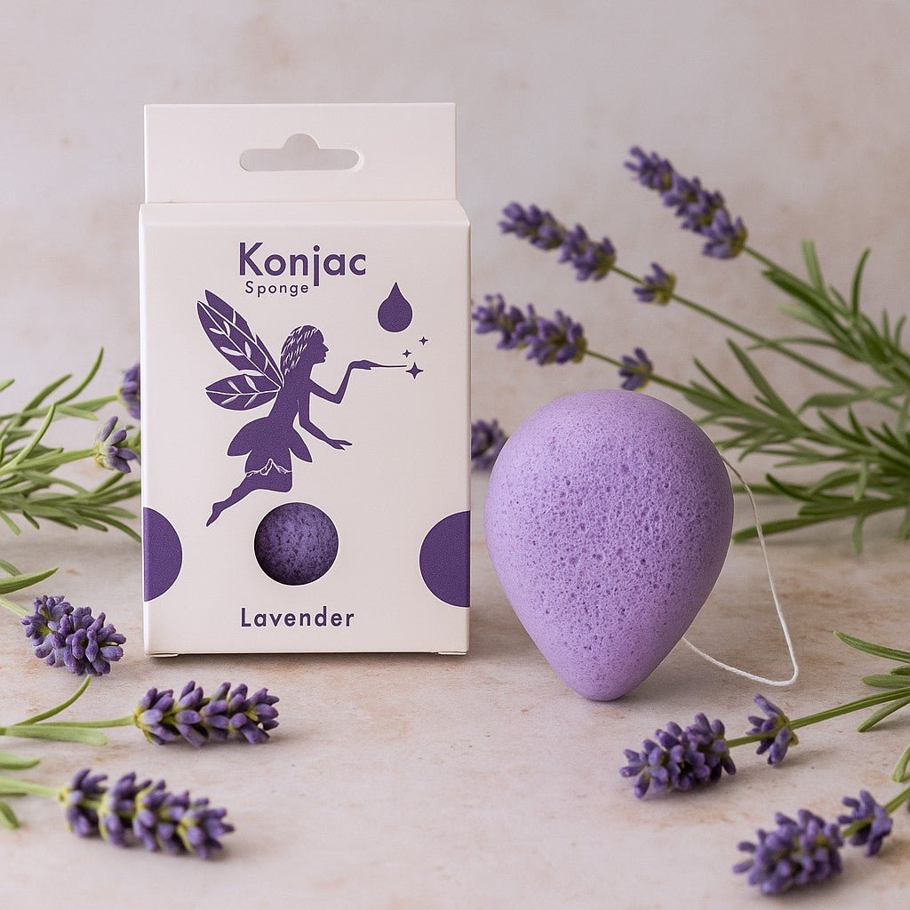 Konjac sponge with lavender packaging and lavender flowers on a light background