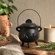Lrg Cast Iron Cauldron with Triple Moon 12 × 15 cm — styled in a warm, naturally lit interior