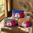 Natural Felt Zipper Pouches - Three Fat Cats — styled in a warm, naturally lit interior