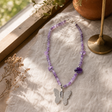 Nymph Amethyst Gemstone Necklace with Real Leaf Butterfly Pendant — styled in a warm, naturally lit interior