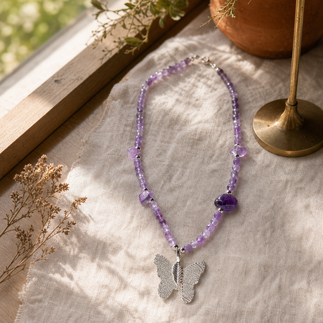 Nymph Amethyst Gemstone Necklace with Real Leaf Butterfly Pendant — styled in a warm, naturally lit interior