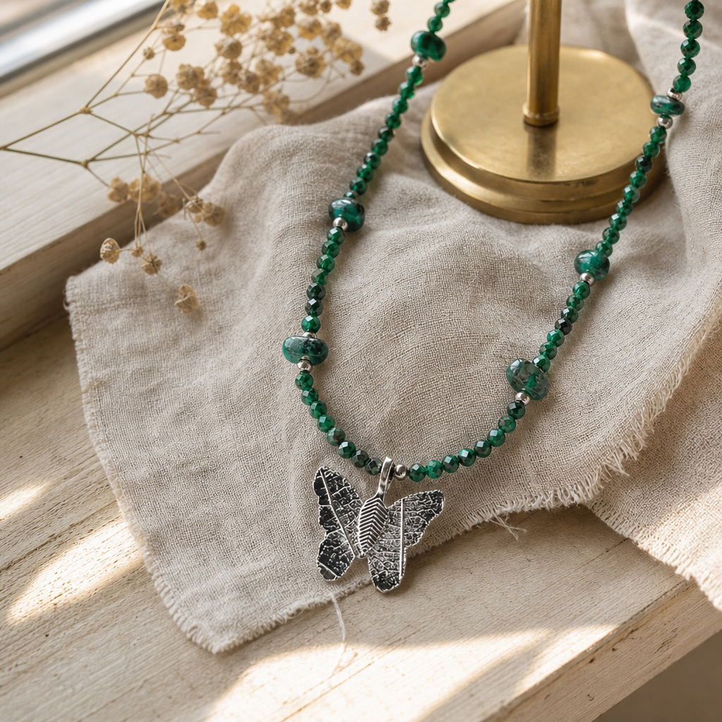 Nymph Malachite Gemstone Necklace with Real Leaf Butterfly Pendant — styled in a warm, naturally lit interior