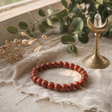 Petite Power Bracelet (17cmx6mm) - Carnelian — styled in a warm, naturally lit interior