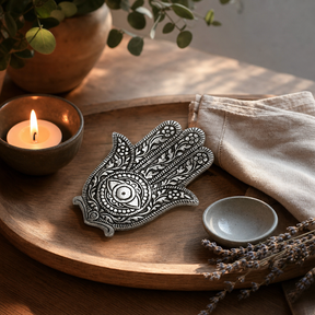 Polished Aluminium Hamsa Incense Holder 14cm — styled in a warm, naturally lit interior