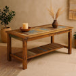 Wooden coffee table with decorative items in a room setting