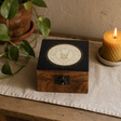 Small Enamelled Box - Capricorn — styled in a warm, naturally lit interior