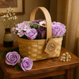 Basket of soap flowers with a tag on a wooden table