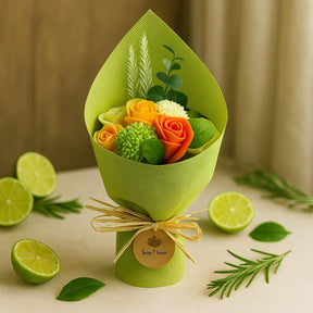 Bouquet of flowers wrapped in green paper with limes and leaves on a beige background