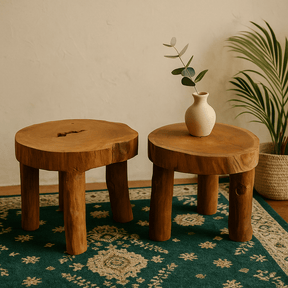 Two wooden stools with a vase on a patterned rug