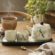Travel Teapot Set & Two Cups - Blue Bird Qing Dynasty — styled in a warm, naturally lit interior