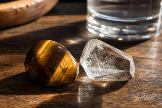 Tiger's eye and clear quartz crystals shown close together