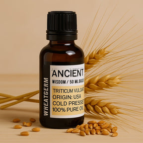 Bottle of Wheat Germ oil with wheat grains on a wooden surface